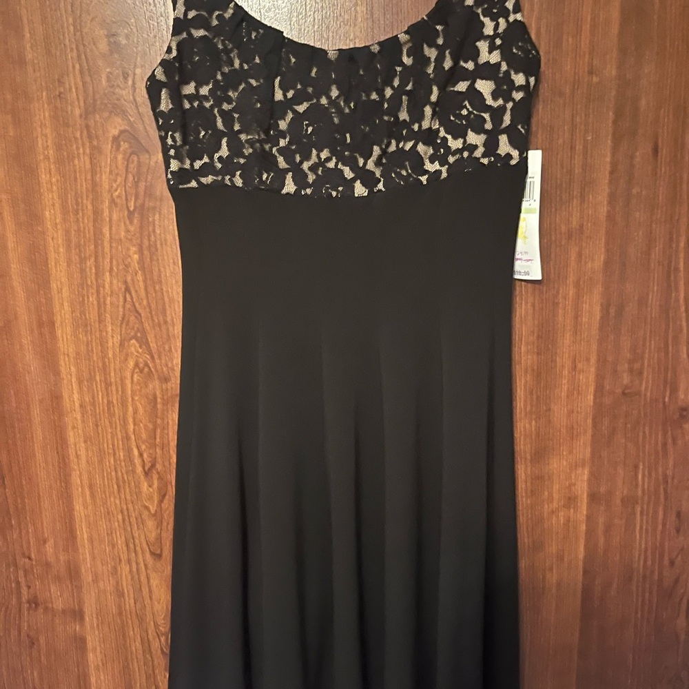 Black dress with pleated skirt